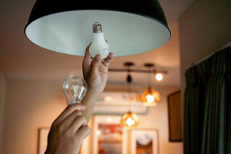 Two Light Bulbs Hold Each Hand - Fort Branch, IN - Angermeier Electric LLC