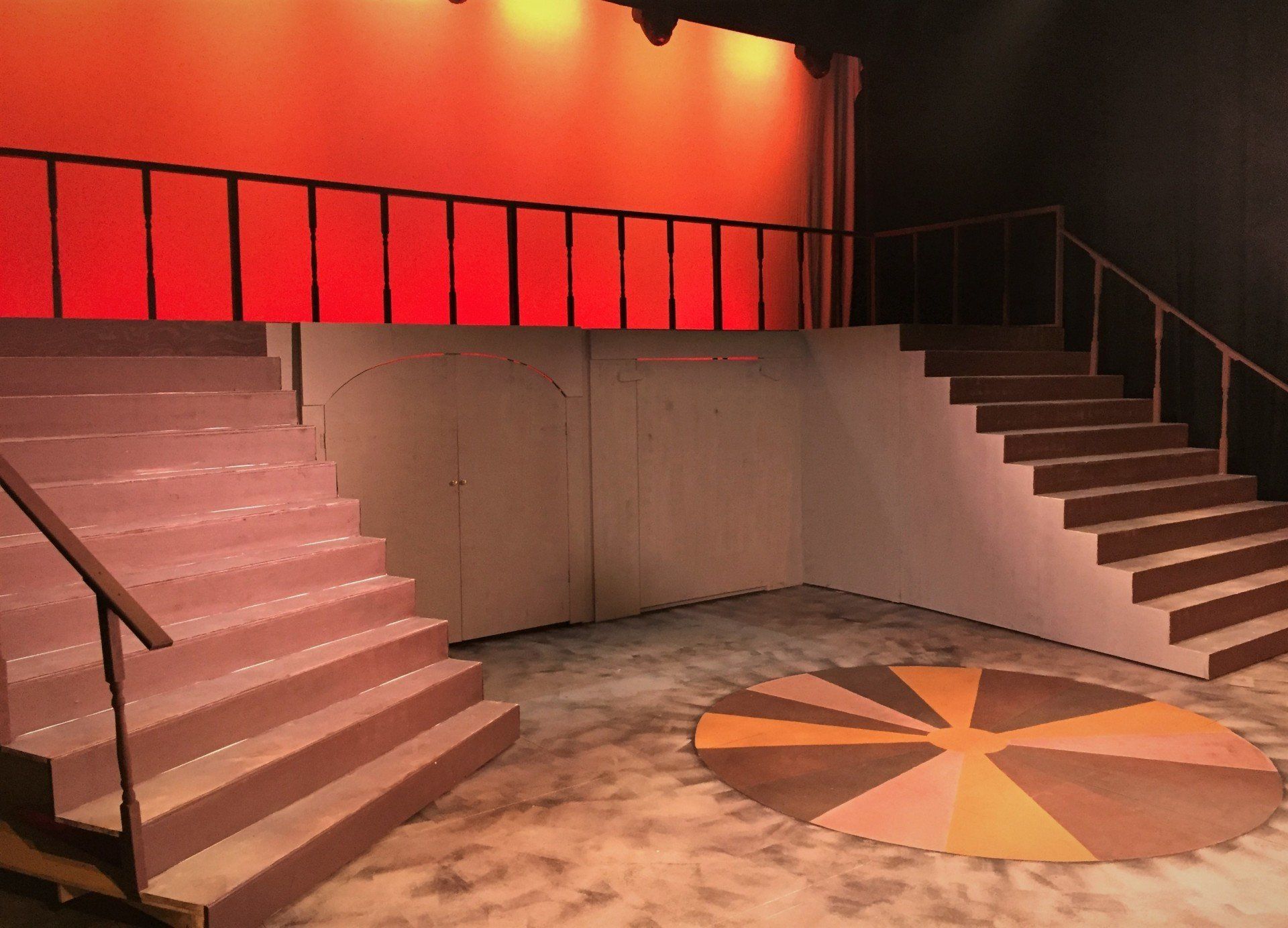 curved constructed staircase with scenic painting