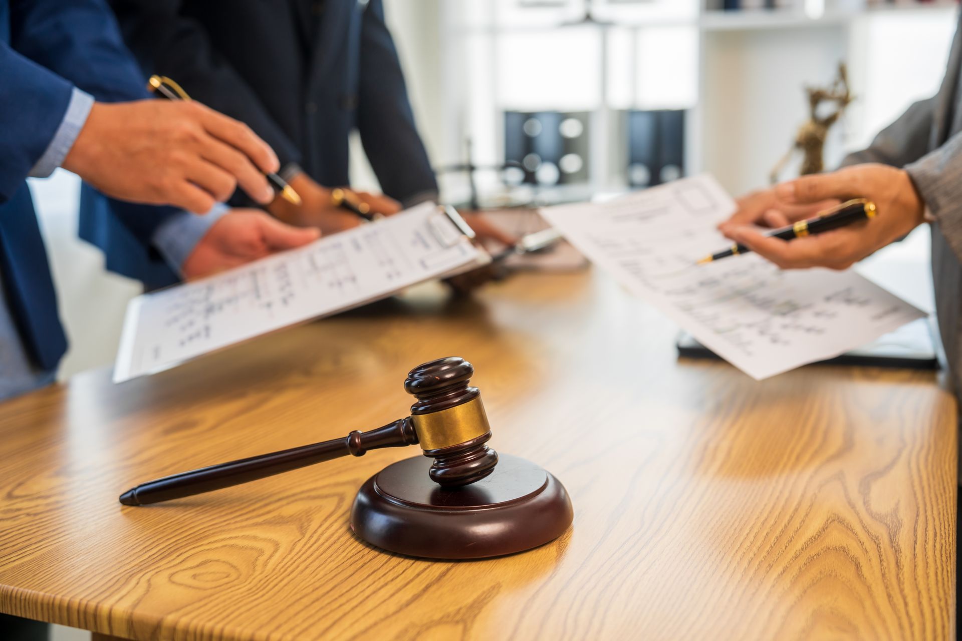 Investigation room with desk, files, photos pinned to a board, lamp, and shelves.