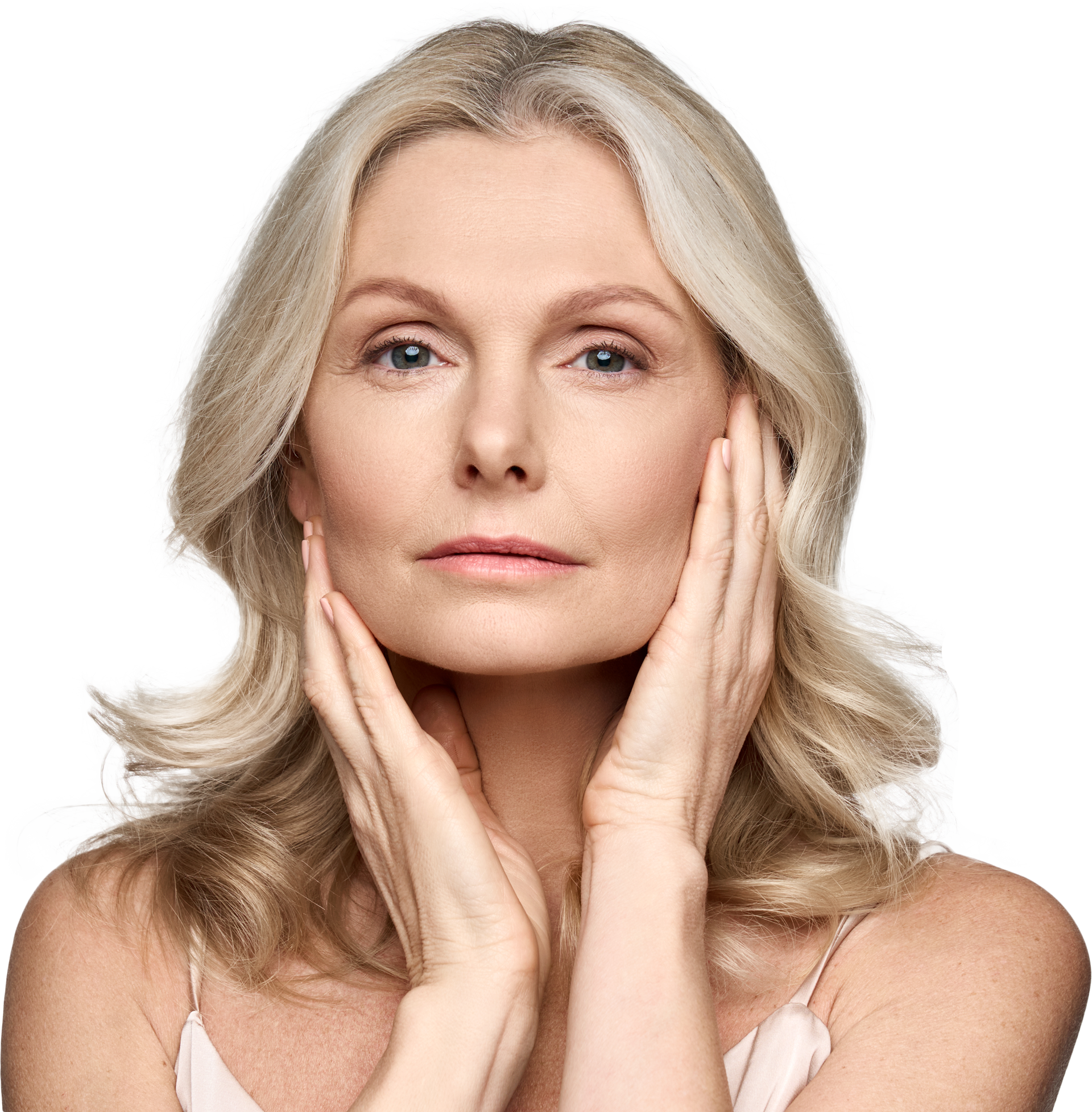 Woman with blonde hair, touching her face with both hands, looking at the camera.