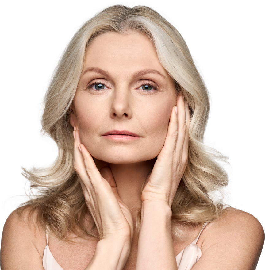 Woman with blonde hair, touching her face with both hands, looking at the camera.