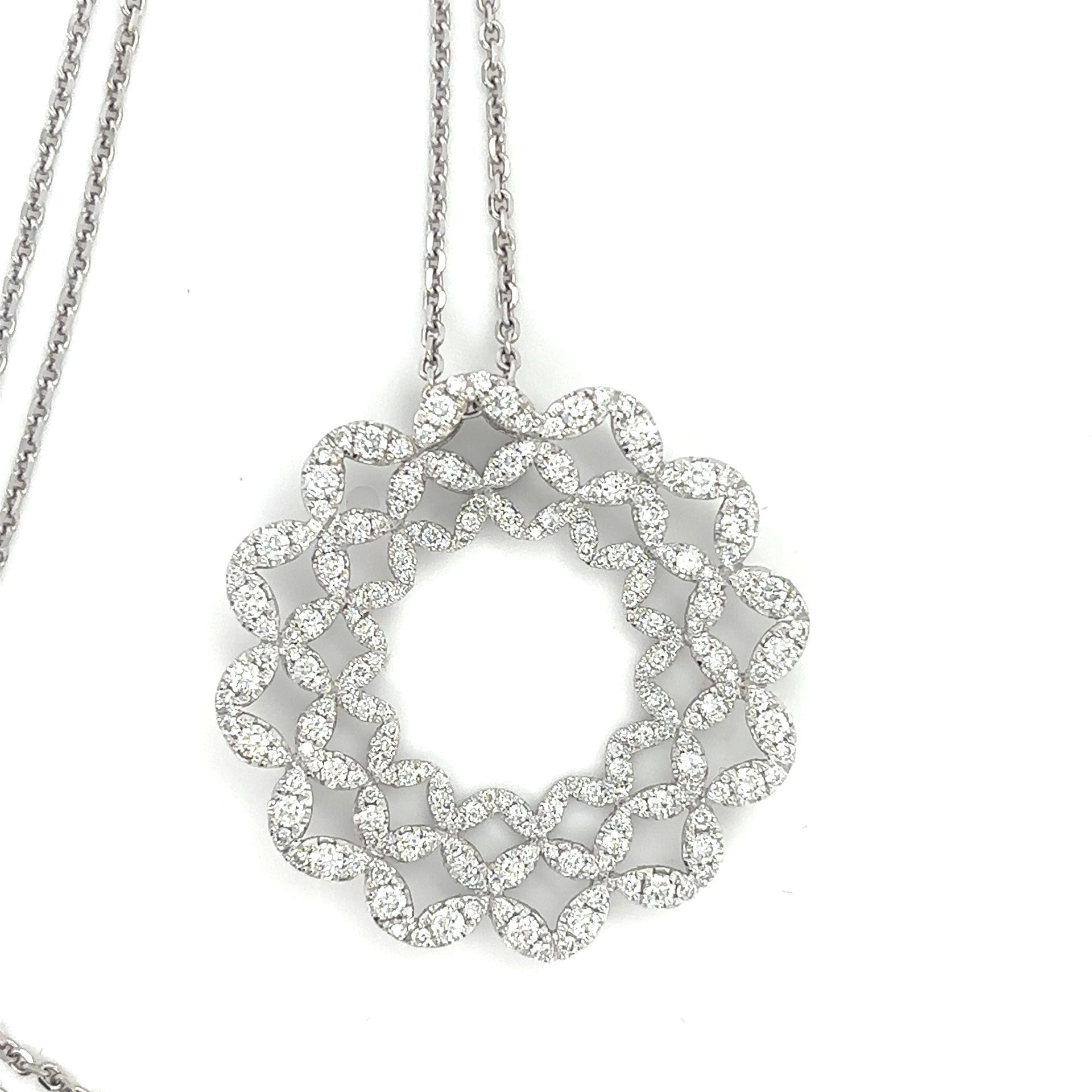 A necklace with a pendant that looks like a wreath of diamonds