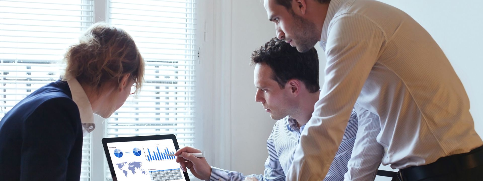 Professional in a meeting discussing the progress report