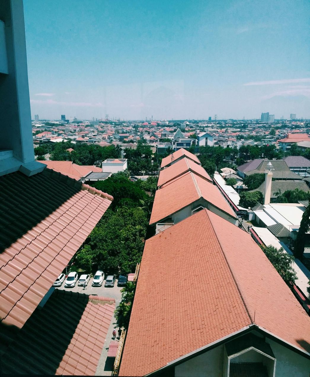 A view of a city from the top of a building