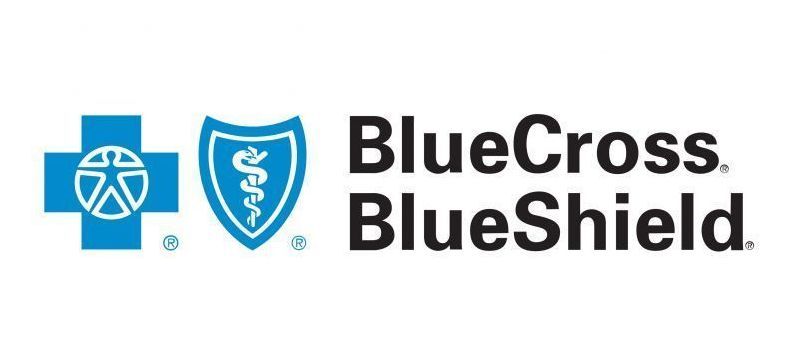 A blue cross and blue shield logo with a cross and shield.