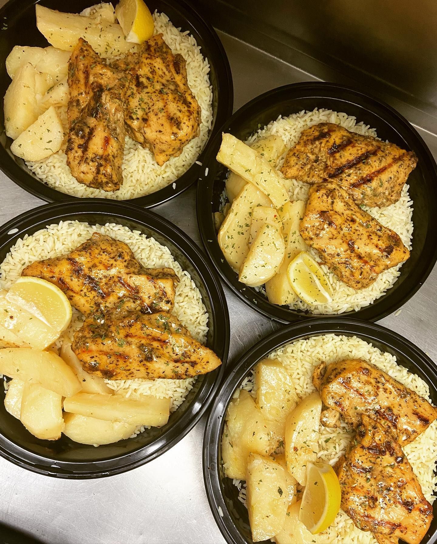 A white plate topped with fried fish and french fries
