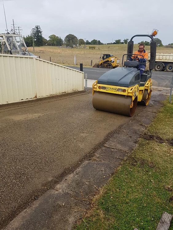 Operator Paving Asphalt with Roller — Civil Contractors in Coopernook, NSW