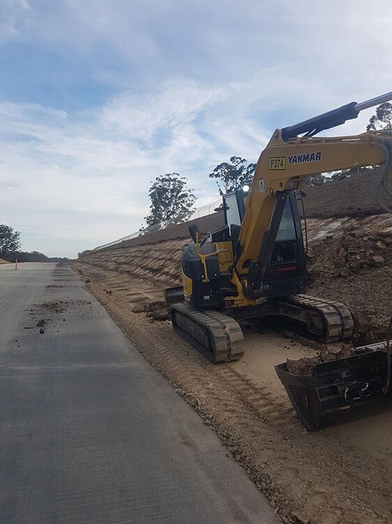 Excavator Parked on Side of Road Construction — Civil Contractors in Coopernook, NSW