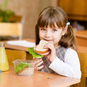 child eating bread