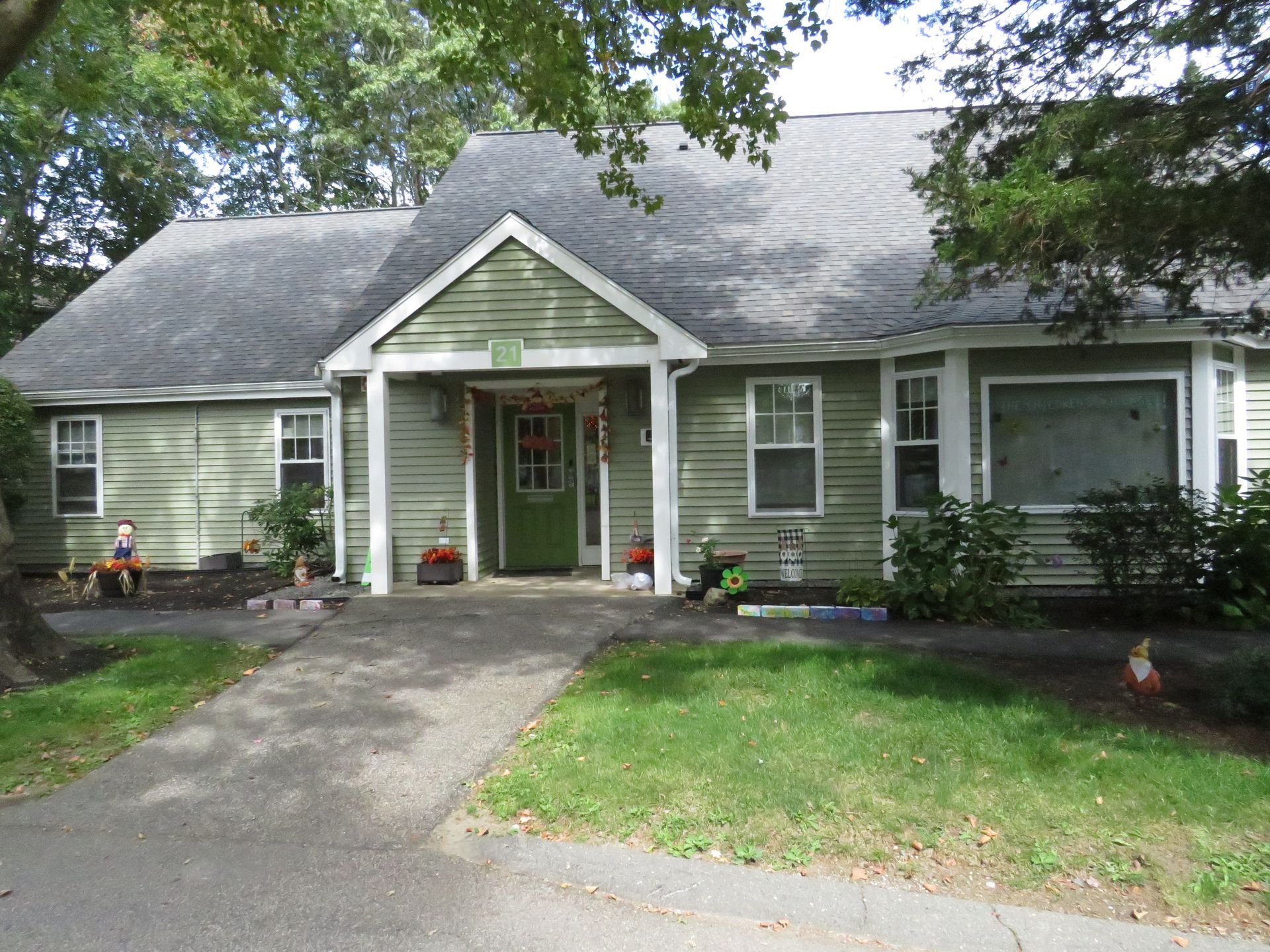 A room with a lot of cribs and toys in it.