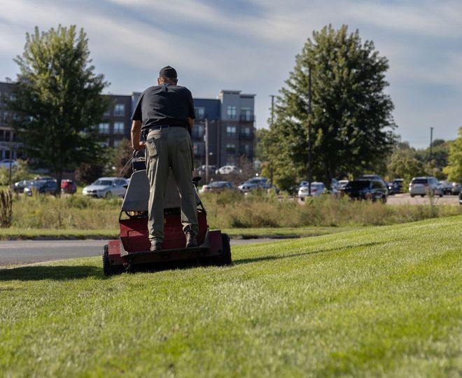 A truck with the grounds crew written on the side
