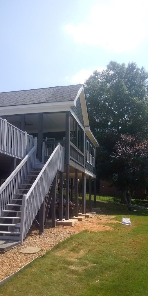 A large house with stairs leading up to the second floor