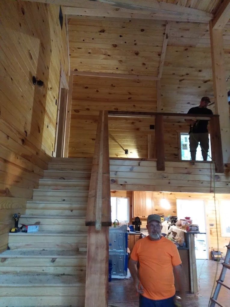 Wooden staircase in a log cabin.