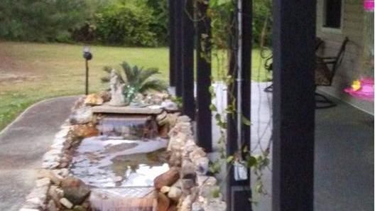 There is a waterfall in the middle of the porch