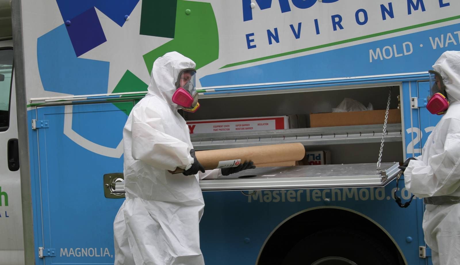 Franchise owner in protective gear working on a rewarding environmental cleanup project