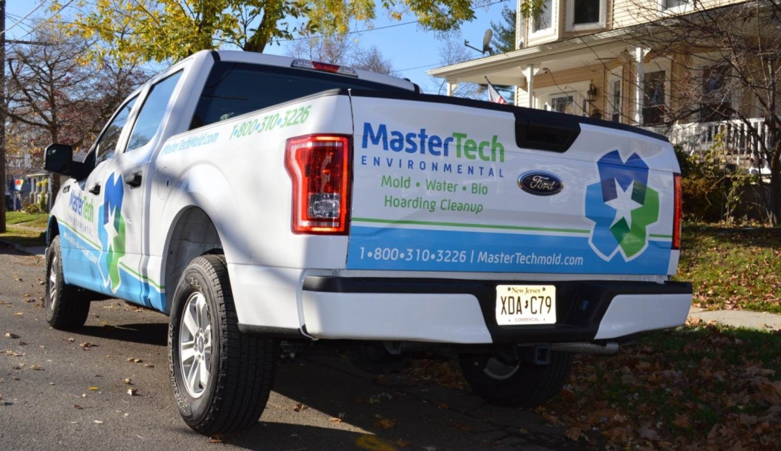 Mold remediation equipment and branded work van showing low-overhead business.