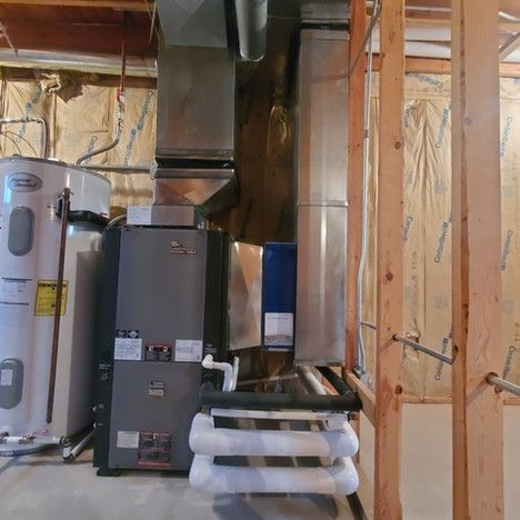 A room with a heater and a water heater in it