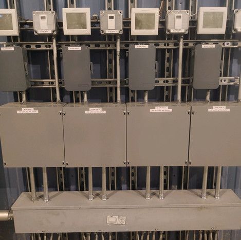 A row of electrical boxes with a label that says ' electrical ' on it