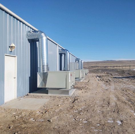 A building with a lot of pipes coming out of it