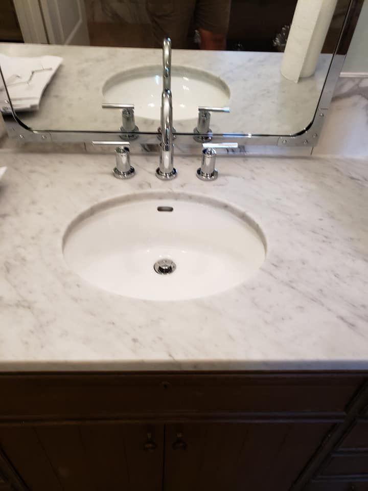 A bathroom sink with a mirror above it