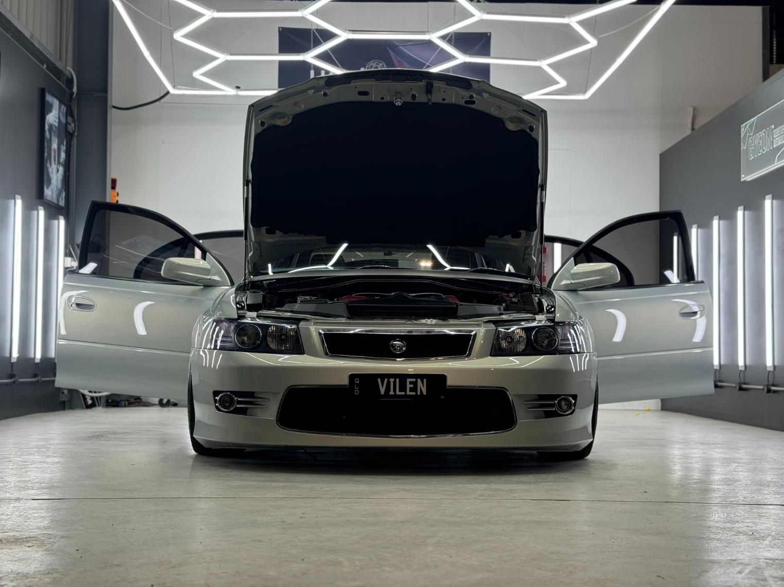 A Silver Car With The Hood Up Is Parked In A Garage — The Works Auto Salon In East Bendigo, VIC