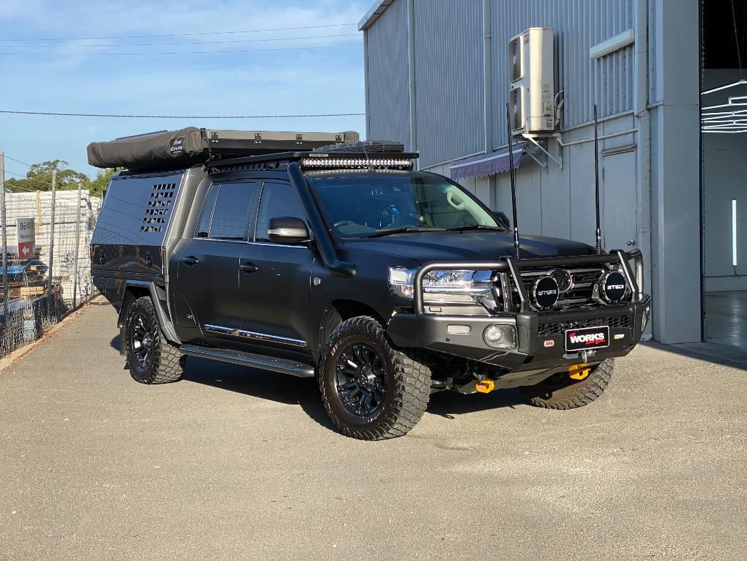 A Black Toyota Land Cruiser Is Parked In Front Of A Building — The Works Auto Salon In East Bendigo, VIC