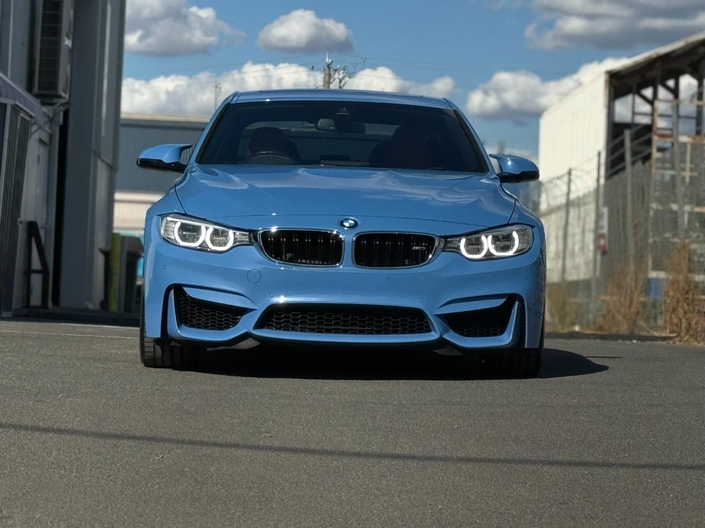 A Blue BMW M3 Is Parked On The Side Of The Road — The Works Auto Salon In East Bendigo, VIC