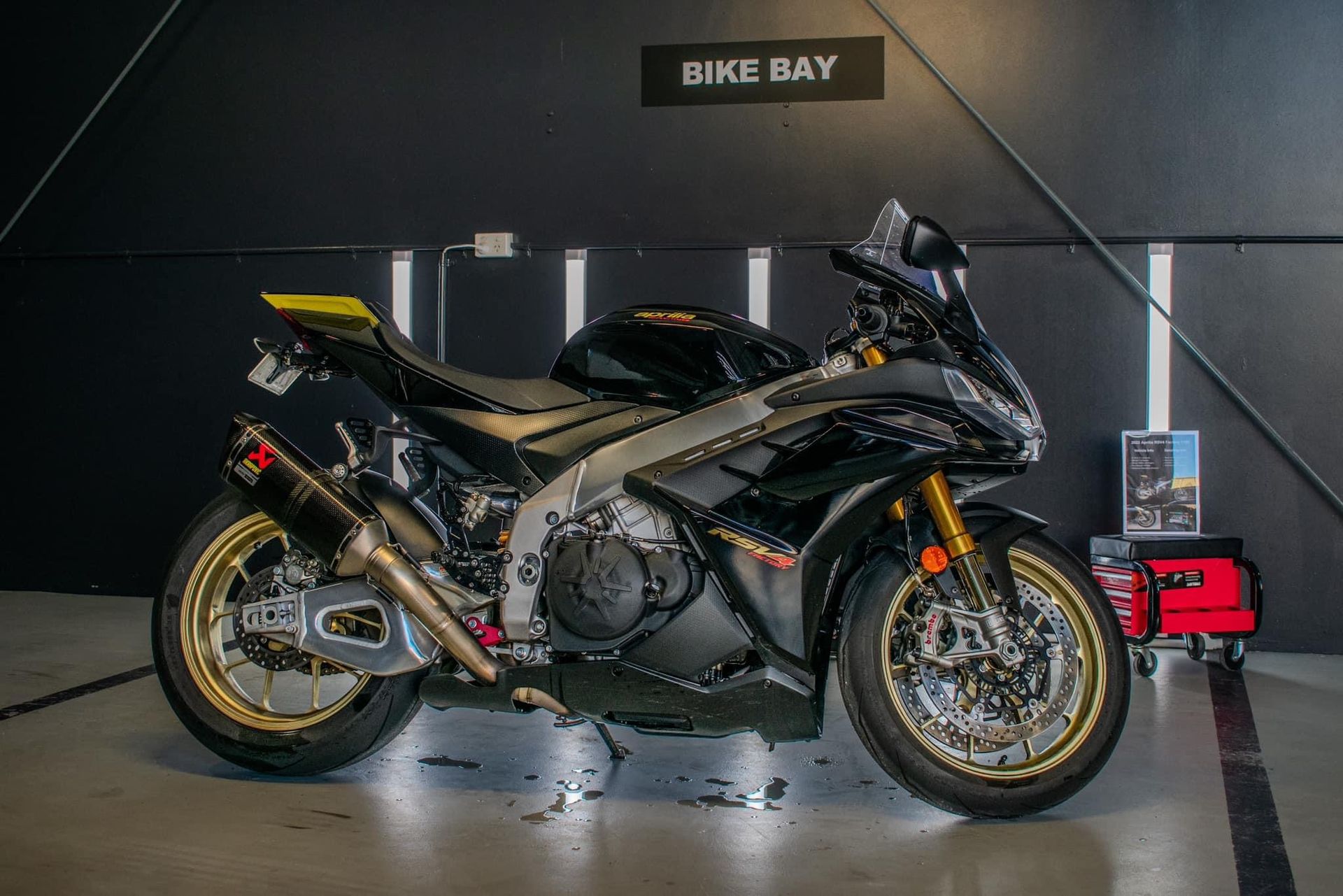 A Black Motorcycle In Front of a Black Wall — The Works Auto Salon In East Bendigo, VIC