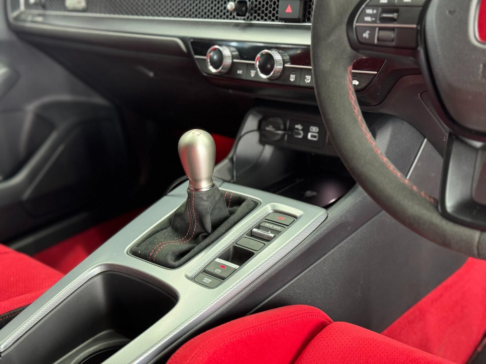 The Interior Of A Car With Red Seats And A Steering Wheel — The Works Auto Salon In East Bendigo, VIC