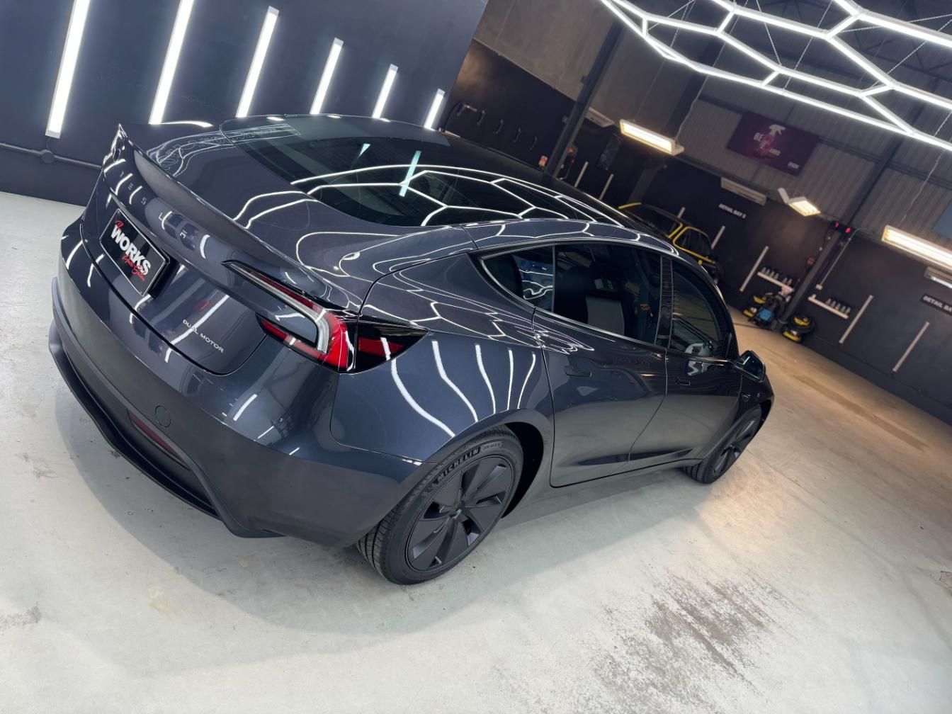 A Black Tesla Model 3 Is Parked In A Garage — The Works Auto Salon In East Bendigo, VIC