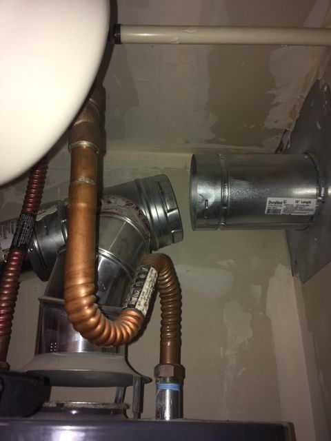 A copper pipe is connected to a metal pipe