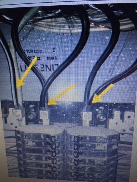A picture of a electrical panel with arrows pointing to the wires