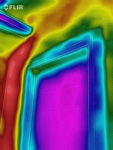 A thermal image of a door with a rainbow of colors.