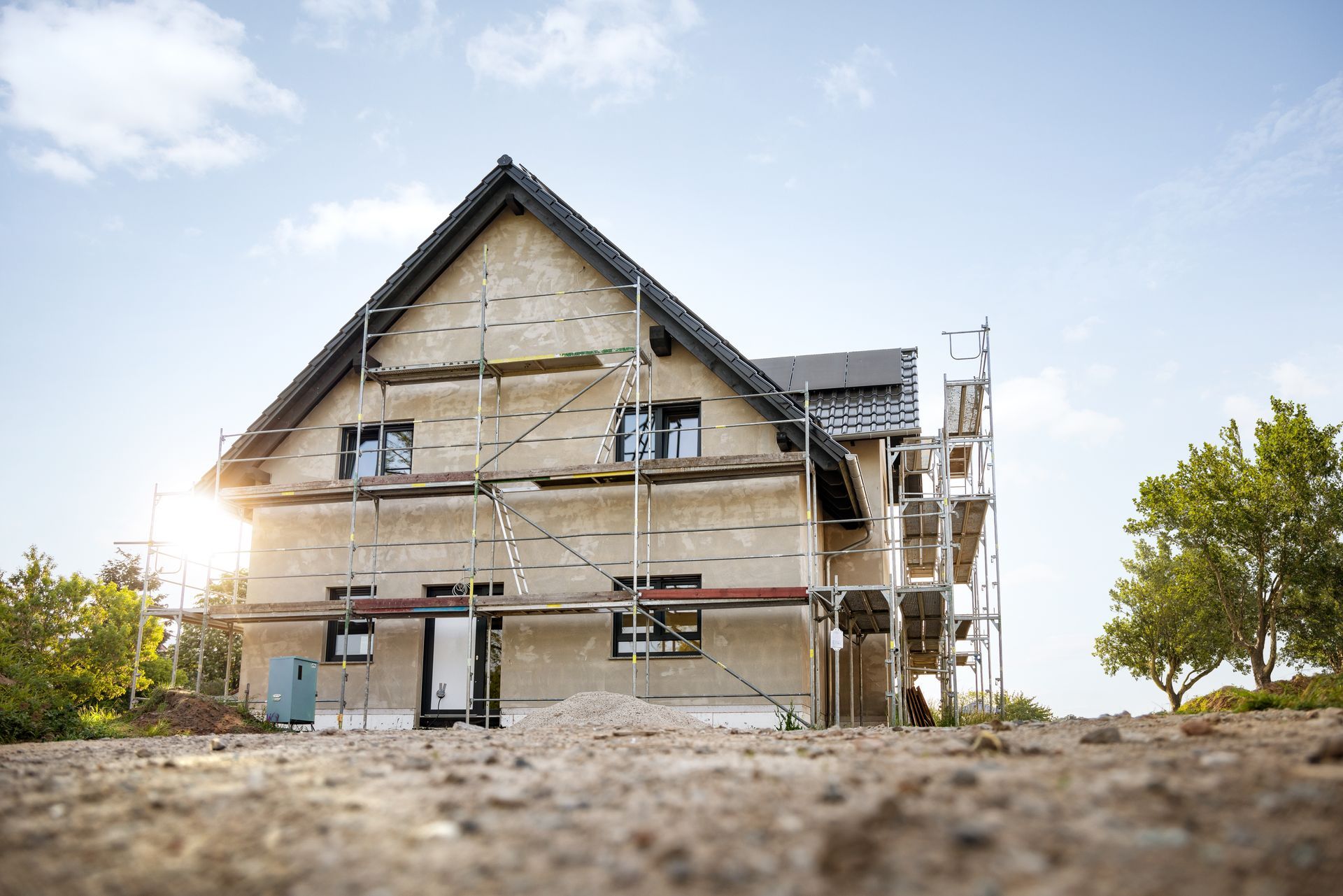 A house is being built with scaffolding around it.