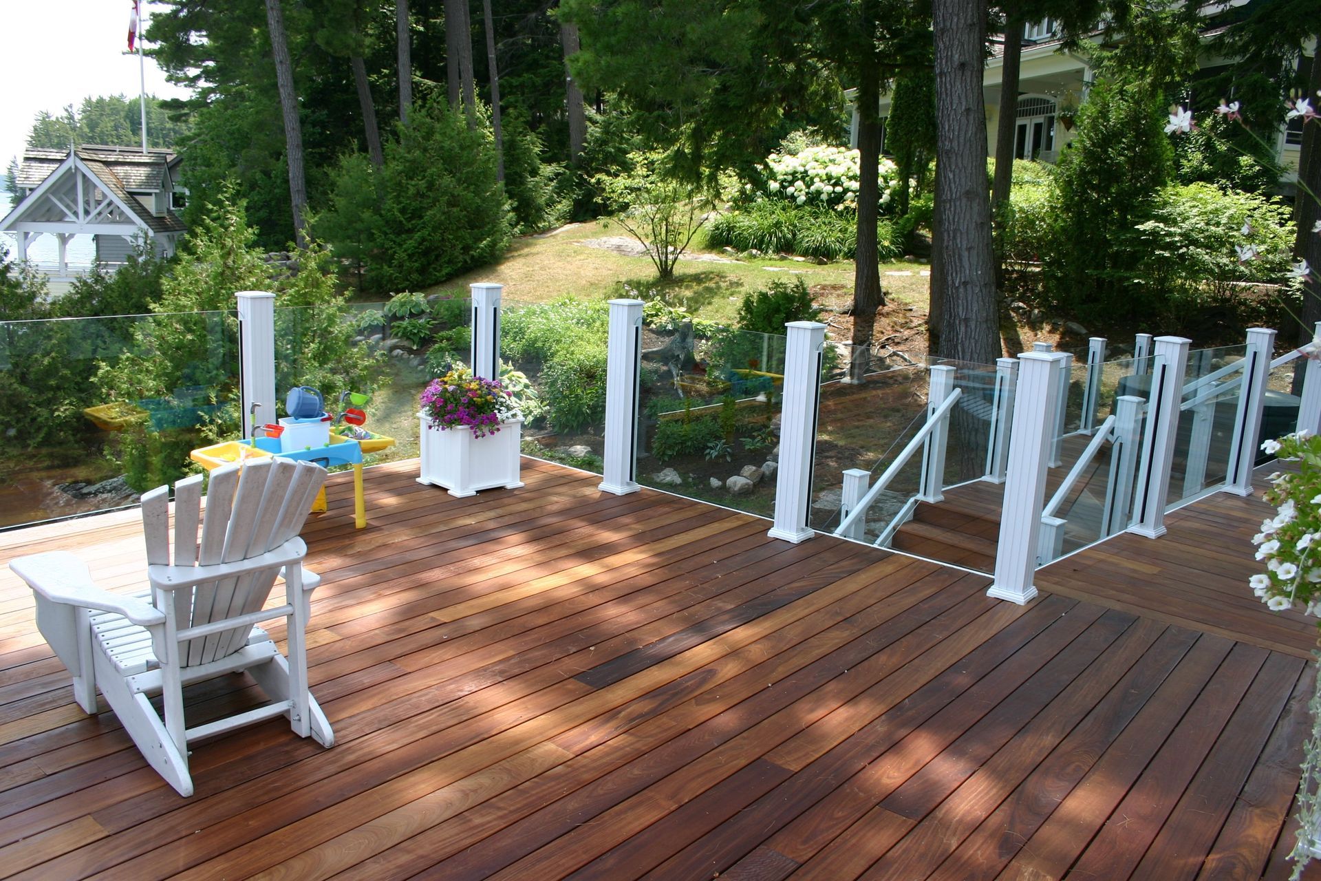 A wooden deck with a rocking chair on it
