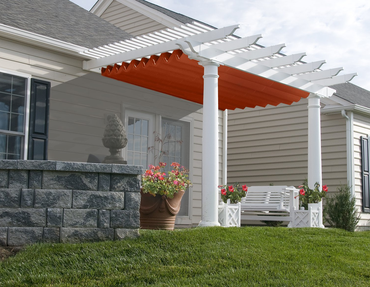 A white pergola with an orange awning over it