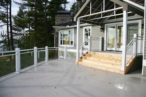 A house with a large deck and stairs leading to it