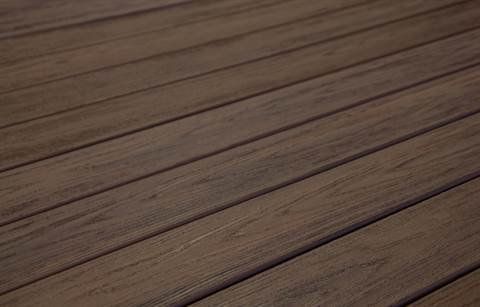 A close up of a brown wooden deck.