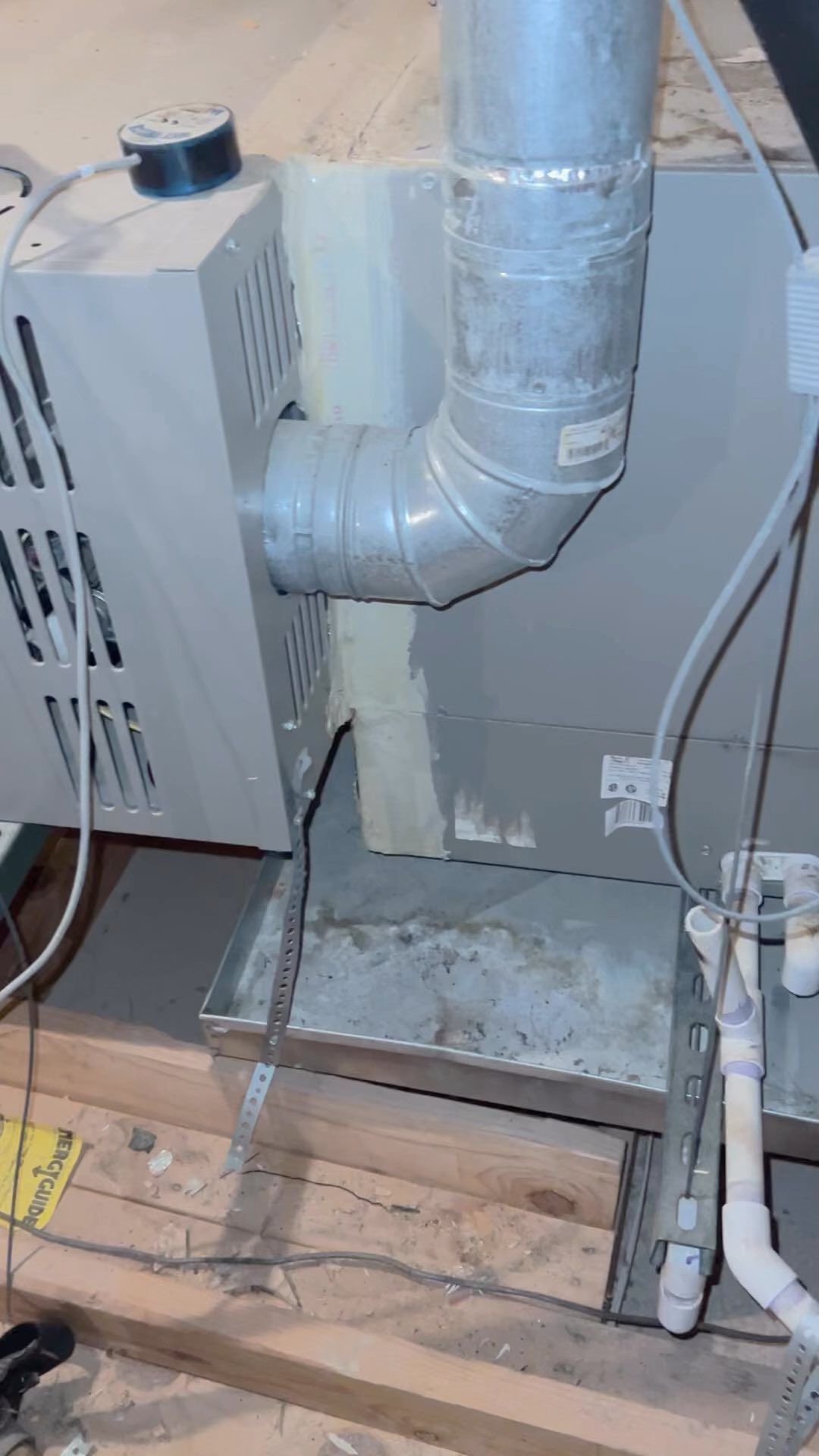 A picture of a ventilation system in a basement.