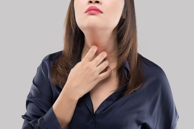 A woman is experiencing Thyroid Disorder Symptoms