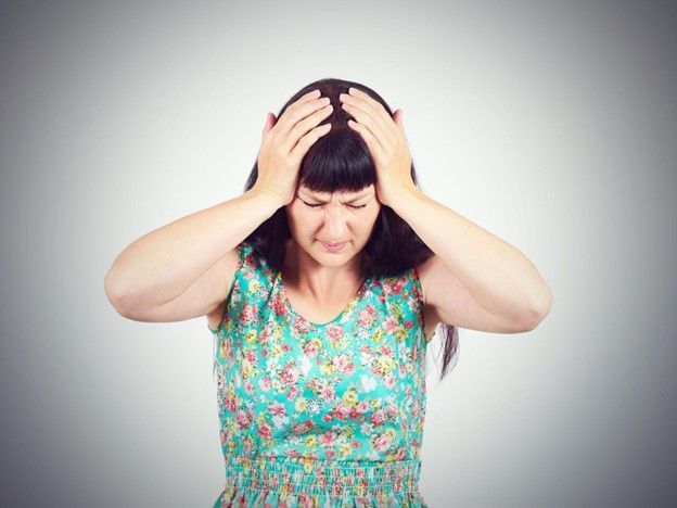 portrait of a woman experiencing dizziness