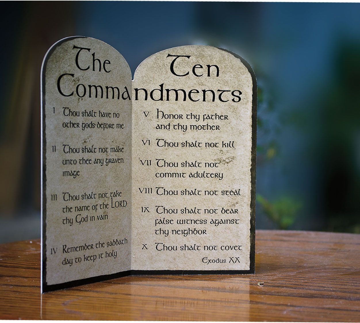 A wooden plaque with the ten commandments written on it