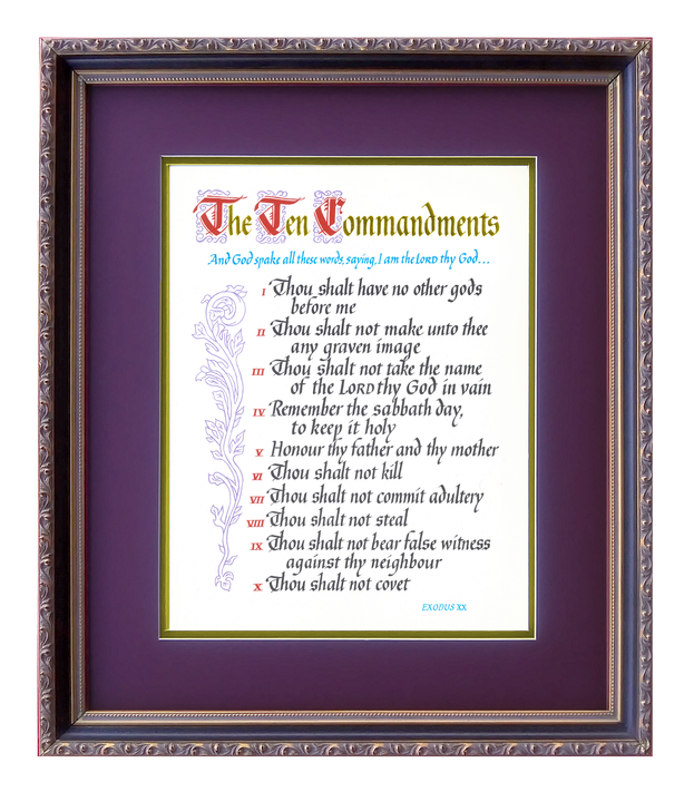 A framed picture of the ten commandments in a purple frame