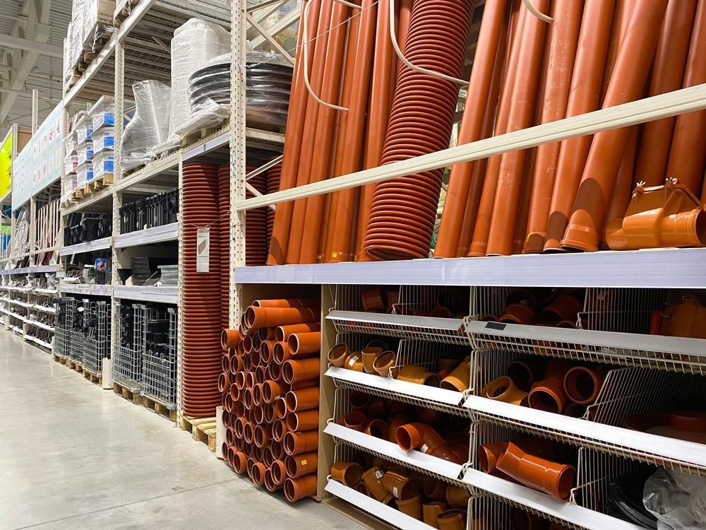 A Warehouse Filled with Lots of Pipes and Containers — Howard Hardware and Building Supplies in Howard, QLD