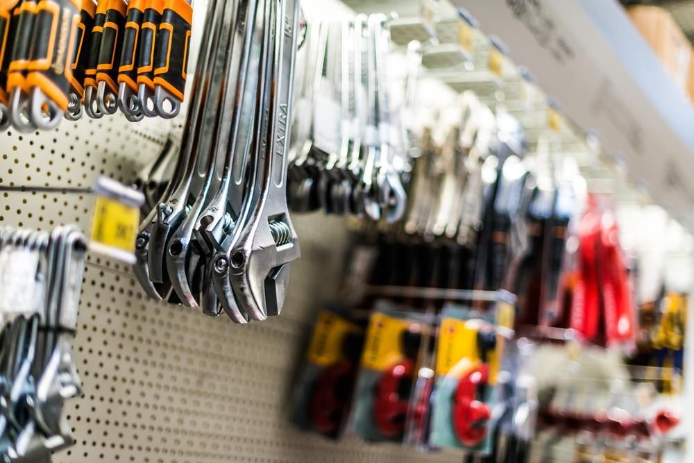 A Bunch of Wrenches Hanging on A Wall in A Store — Howard Hardware and Building Supplies in Howard, QLD