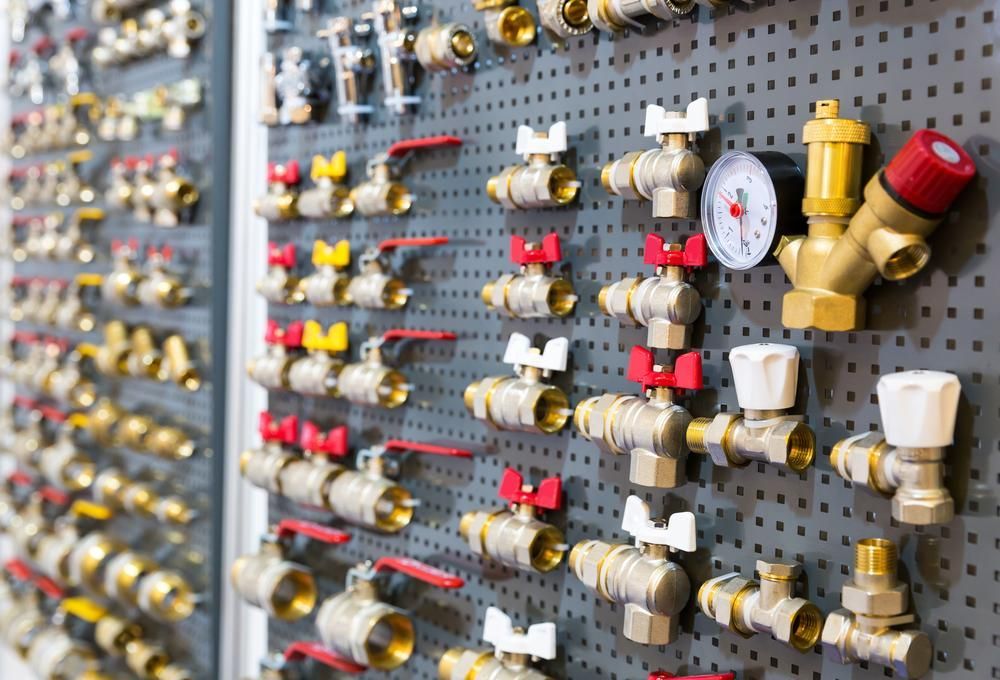 There Are Many Different Types of Valves and Fittings on The Wall — Howard Hardware and Building Supplies in Howard, QLD