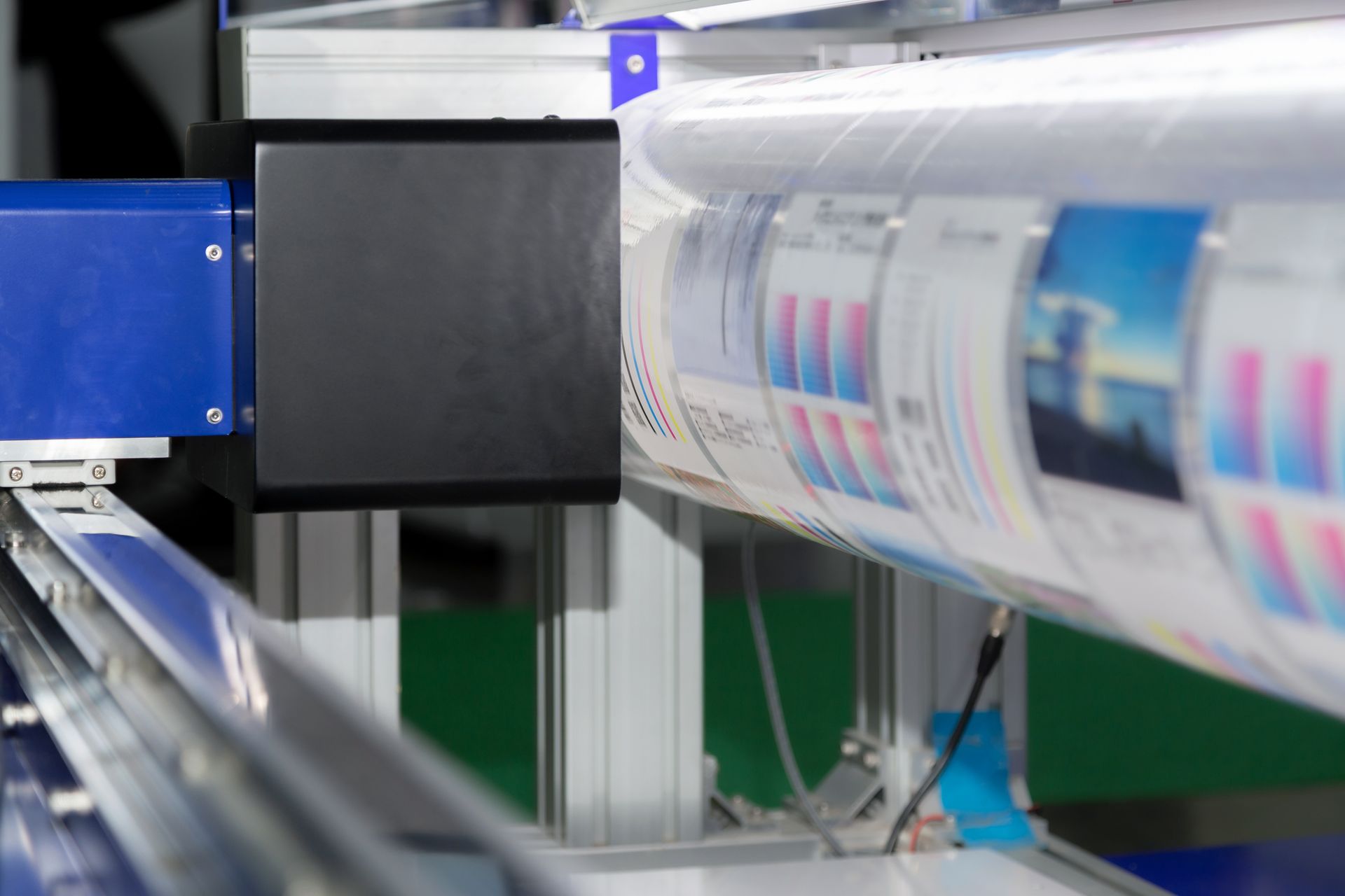 a large roll of paper is being printed on a machine .