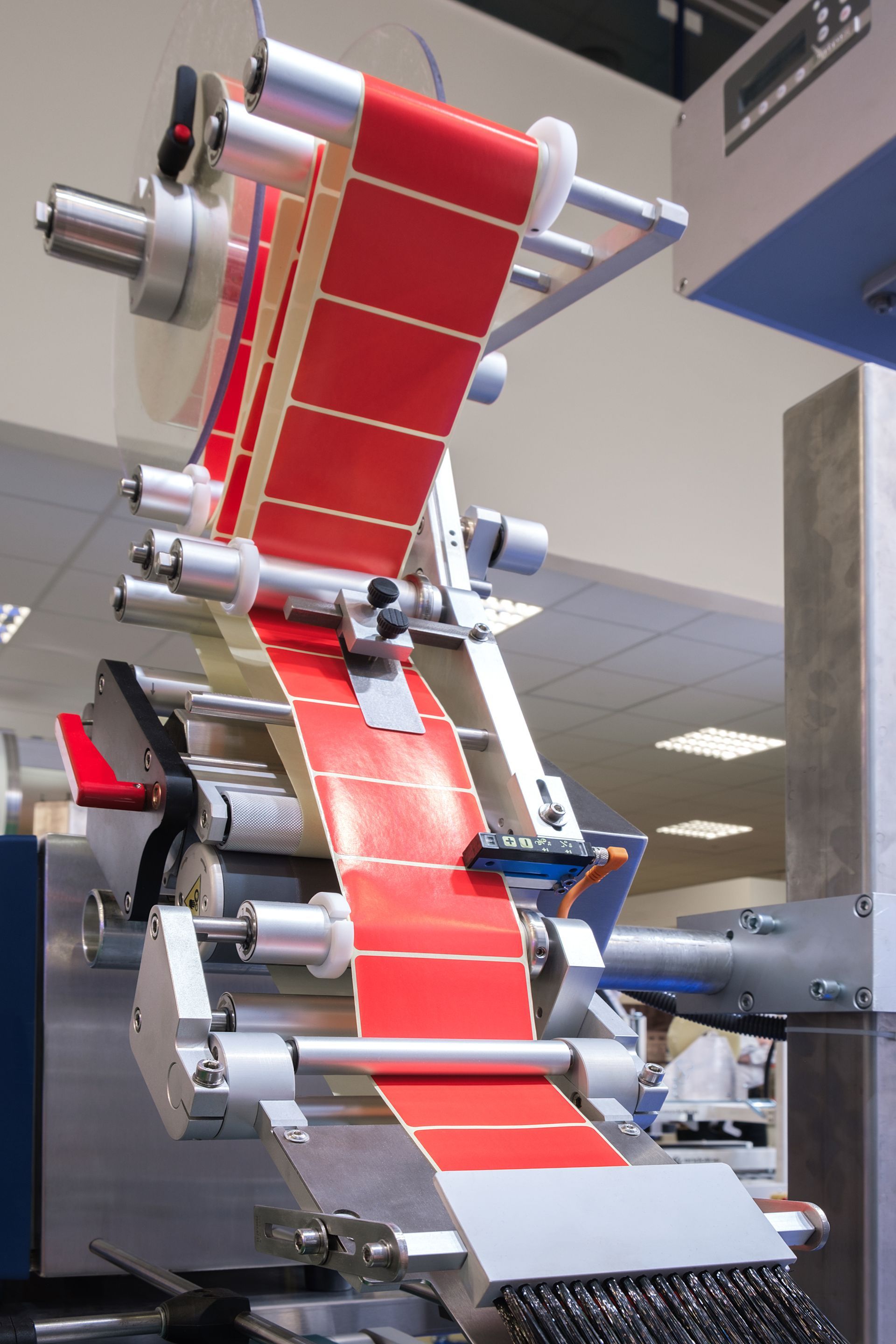 a machine that is printing labels on a roll