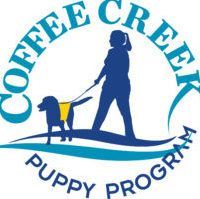 The coffee creek puppy program logo shows a woman walking a dog on a leash.