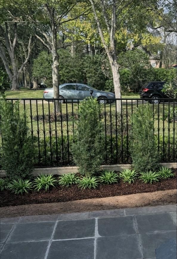 Pool area enclosed by screen, with flagstone path, river rock, pool, and spa.